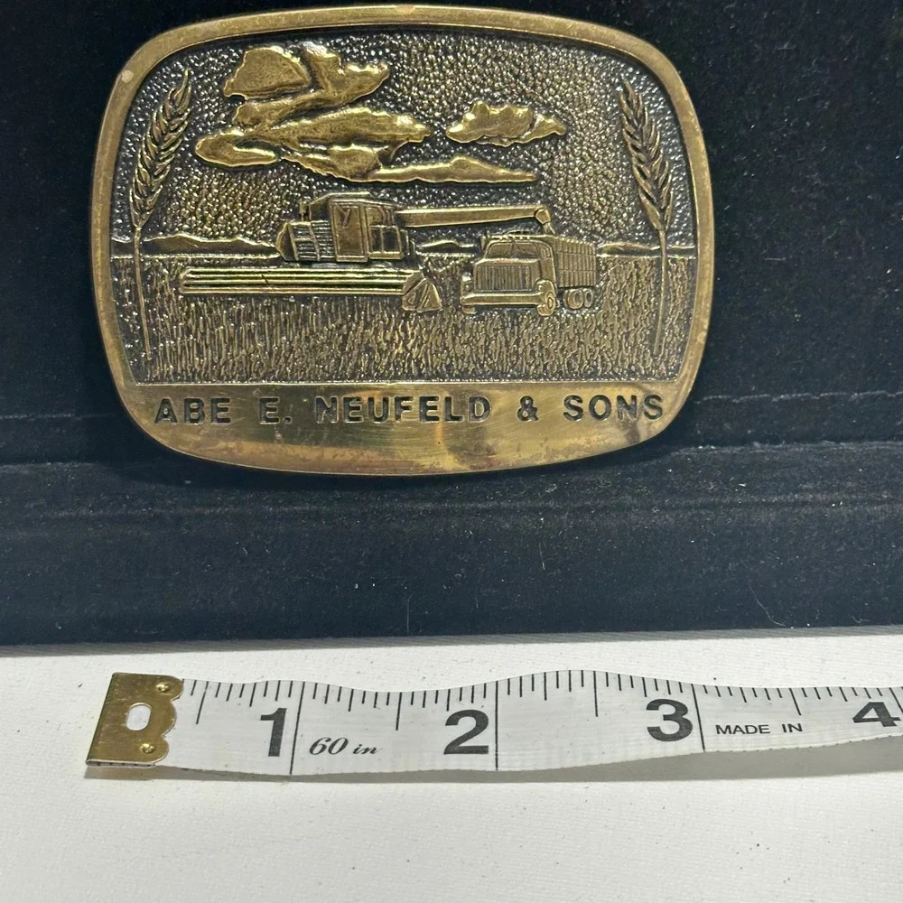 Vintage Abe E Neufeld & Sons Brass Combine Wheat Farm Advertising Belt Buckle